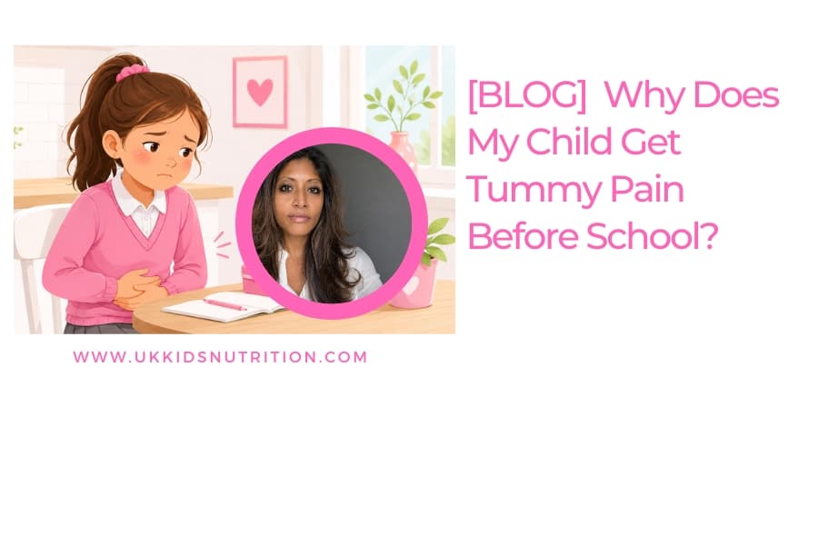 Young child in school uniform at the kitchen table holding their tummy in discomfort before school